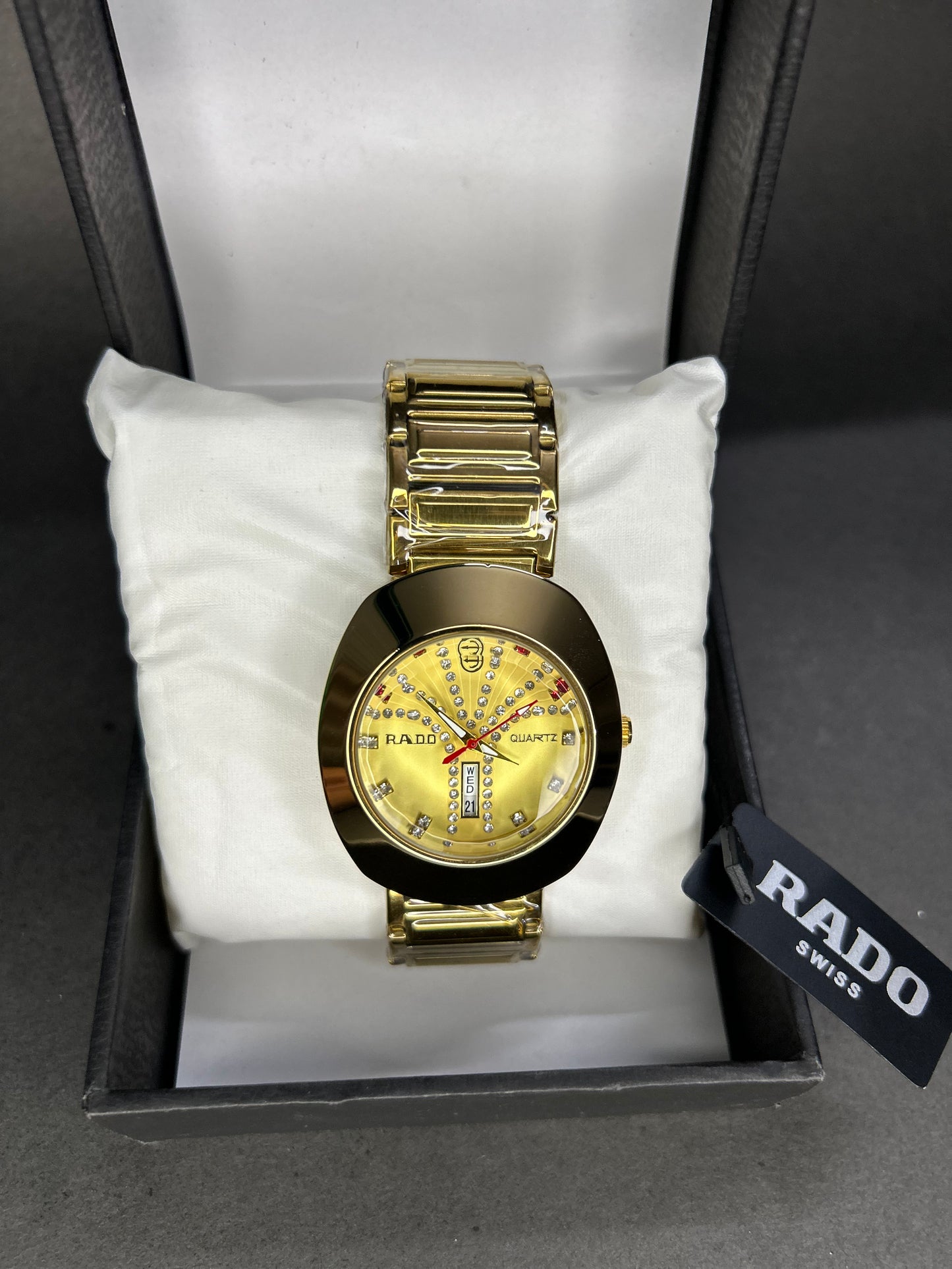 Rado with golden dial with date and day