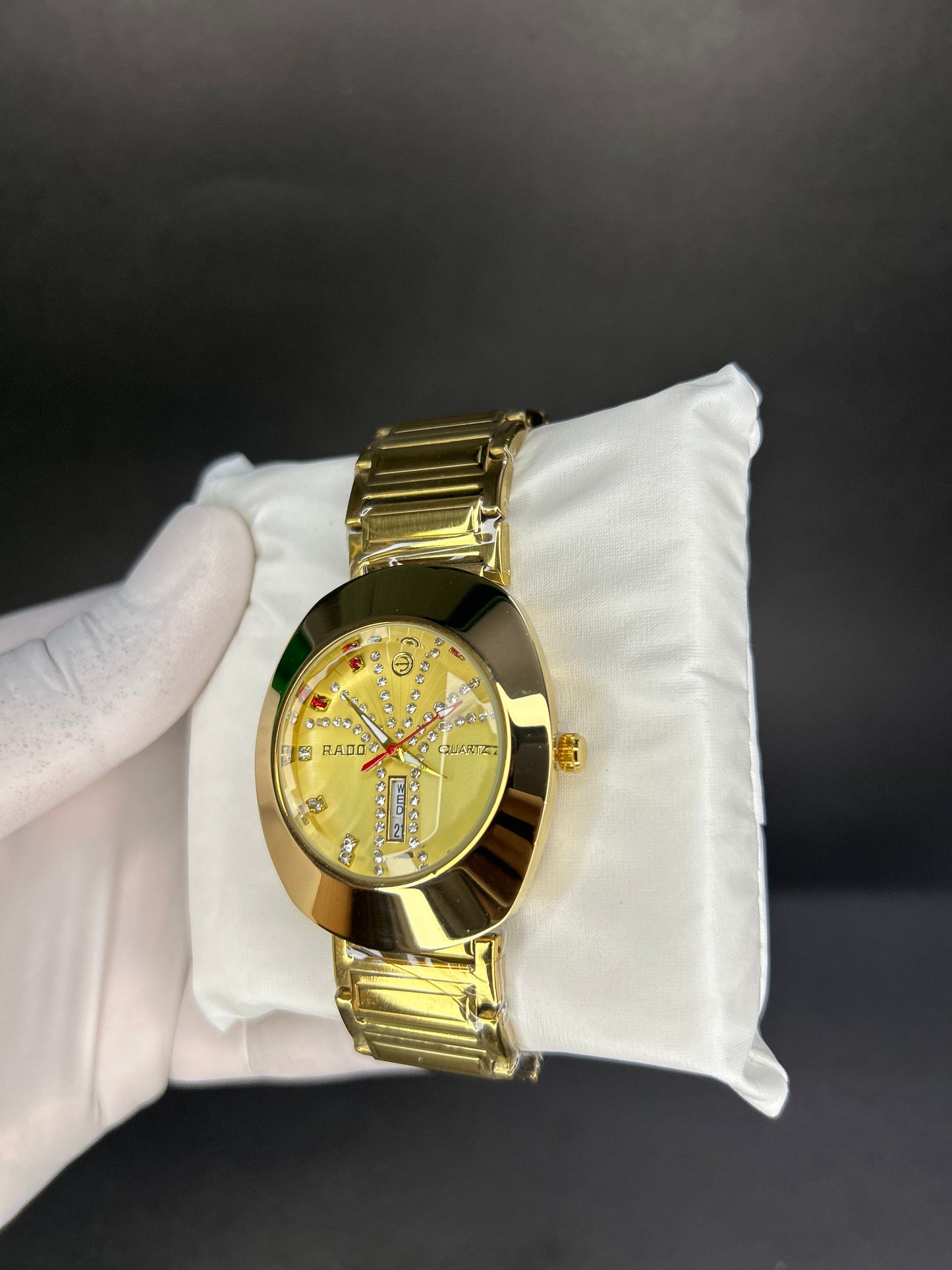 Rado with golden dial with date and day
