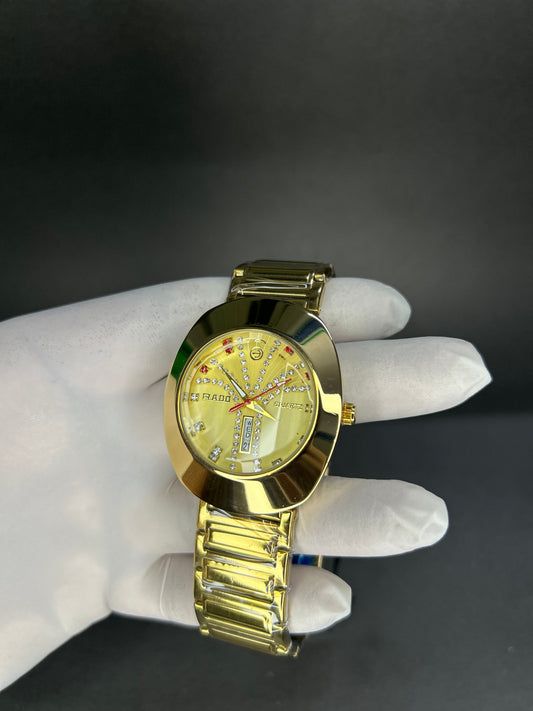 Rado with golden dial with date and day